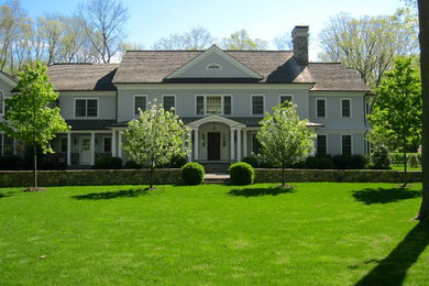 Photo of a large traditional front yard partial sun garden in New York with a garden path.