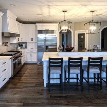 White Transitional Kitchen with Black Hardware and Glass Tile Backsplash