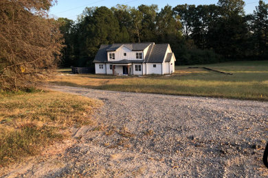 Mid-sized farmhouse home design photo in Atlanta