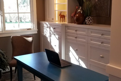 Study room - mid-sized contemporary freestanding desk carpeted and beige floor study room idea in Omaha with beige walls