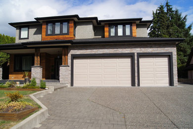 Mid-sized contemporary gray two-story exterior home idea in Vancouver