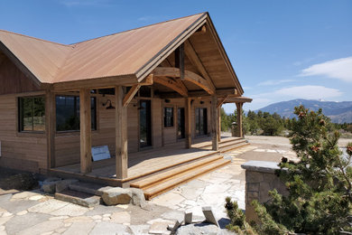 This is an example of a rustic porch design in Denver.