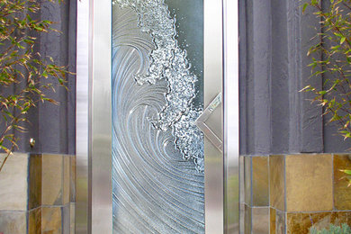 Inspiration for a mid-sized coastal entryway remodel in San Diego with purple walls and a glass front door