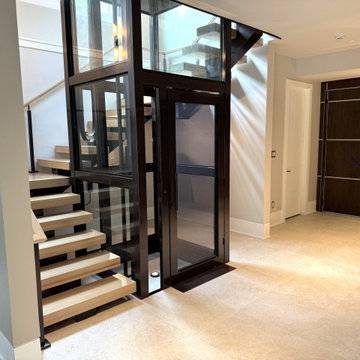 Project #136 | Modern Floating Staircase Encircling Glass Elevator