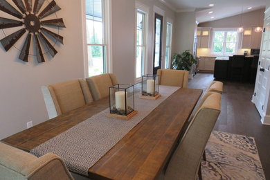 Kitchen/dining room combo - large cottage dark wood floor kitchen/dining room combo idea in Grand Rapids with beige walls and no fireplace
