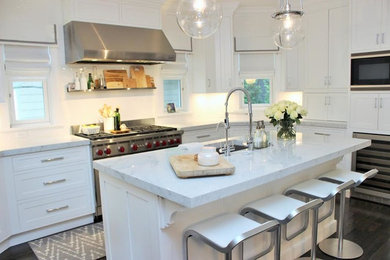 Large transitional u-shaped dark wood floor open concept kitchen photo in New York with white cabinets, white backsplash, stainless steel appliances, an island, an undermount sink, shaker cabinets and marble countertops
