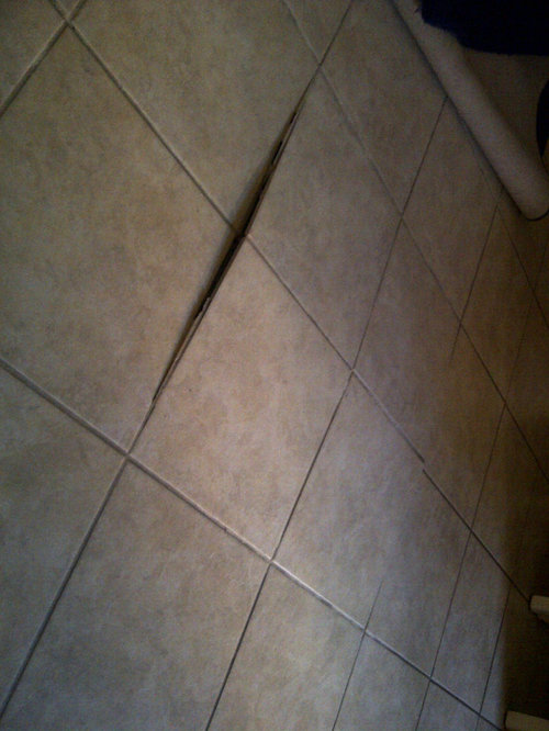 NEED HELP Family room tiles are popping up!