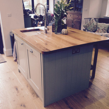 Traditional cream, handmade kitchen with wooden worktops and statement tiles