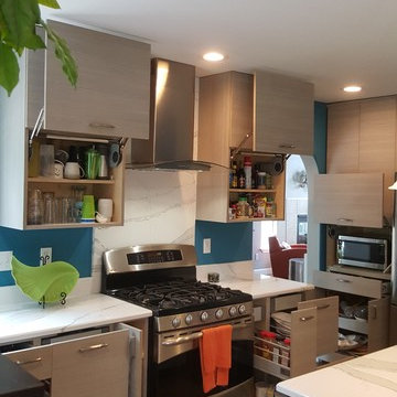 This is a two tone updated kitchen with efficient use of space & feature points