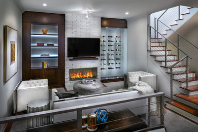 Photo of a mid-sized modern open concept living room in Tampa with white walls, dark hardwood floors, a stone fireplace surround, a built-in media wall and brown floor.