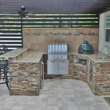 Outdoor kitchen with Solaire infrared grill, Big Green Egg, fire pit and pergola