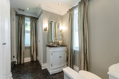 Alcove shower - small traditional 3/4 black tile and subway tile mosaic tile floor alcove shower idea in Montreal with beaded inset cabinets, white cabinets, a two-piece toilet, gray walls, an undermount sink and granite countertops