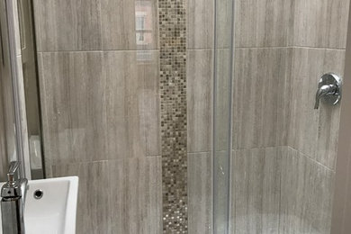 Example of a small minimalist beige tile and ceramic tile alcove shower design in Ottawa