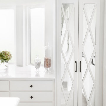 Bathroom storage with mirrored insets
