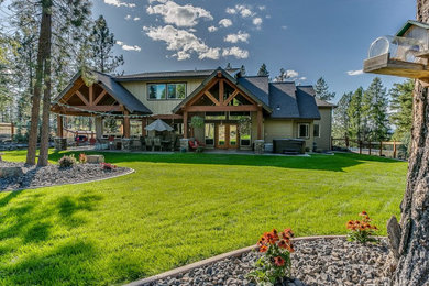Large arts and crafts gray two-story wood exterior home photo in Seattle with a shingle roof