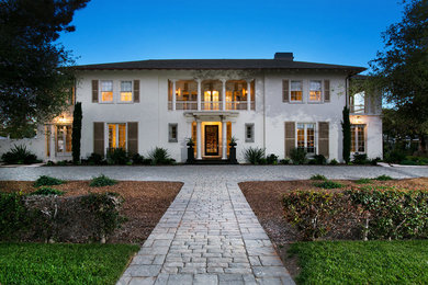 Inspiration for a huge timeless two-story stucco exterior home remodel in San Diego