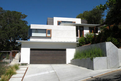 Inspiration for a large modern two-storey white exterior in San Francisco with mixed siding.