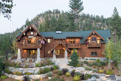 Example of a large mountain style brown two-story wood exterior home design in Sacramento with a shingle roof
