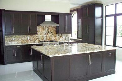 Design ideas for a large traditional l-shaped eat-in kitchen in Miami with an undermount sink, recessed-panel cabinets, dark wood cabinets, granite benchtops, multi-coloured splashback, stone slab splashback, stainless steel appliances, porcelain floors and with island.