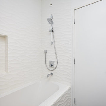 Wave Tile Tub Wall Beside Black Lever Door Handle