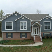 tan brick with blue siding