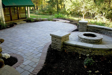 Patio with fire pit and seating wall