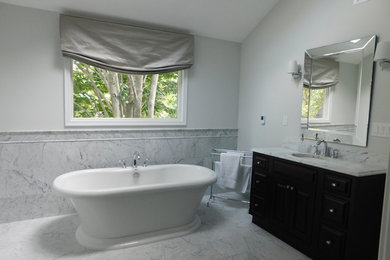 Freestanding bathtub - mid-sized transitional master multicolored tile and stone slab marble floor and multicolored floor freestanding bathtub idea in Other with shaker cabinets, dark wood cabinets, a two-piece toilet, white walls, an undermount sink and marble countertops