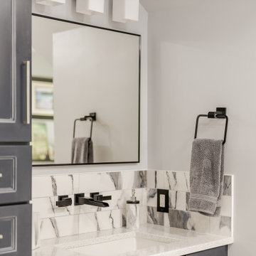 Bathroom remodeling in Columbia, MD with double vanity & marble bathtub