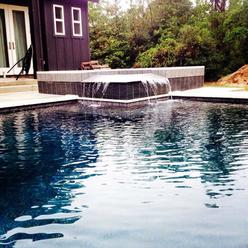 Contemporary spa with glass tile