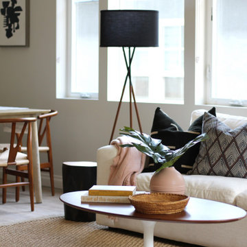 Black Tripod Lamp and Saarinen Style Coffee Table
