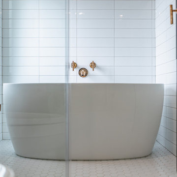Bathroom remodeling in Arlington, VA with double vanity & corner bathtub