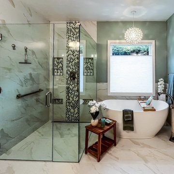 Primary Bath with Marble Look Tiled Shower and Free Standing Tub