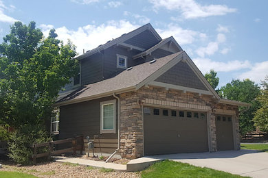 Example of a mid-sized classic gray two-story mixed siding exterior home design in Denver with a shingle roof