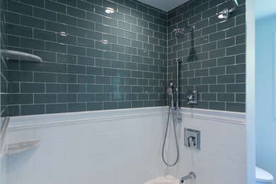 Mid-sized modern master bathroom in Boston with recessed-panel cabinets, black cabinets, an alcove tub, a shower/bathtub combo, gray tile, subway tile, marble benchtops, a shower curtain, white walls, marble floors, an undermount sink and white floor.