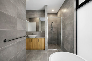 Inspiration for a contemporary 3/4 bathroom in Melbourne with flat-panel cabinets, light wood cabinets, grey walls, a vessel sink, engineered quartz benchtops, a double vanity and a built-in vanity.