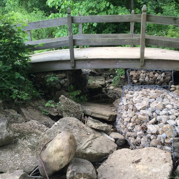 Filled gabion baskets to support bridge and embankment