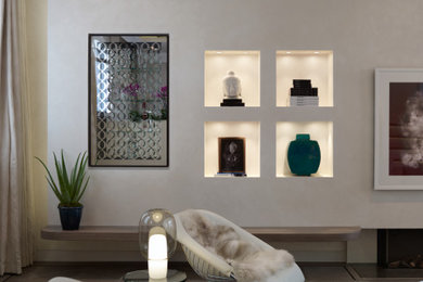 Inspiration for a large modern grey and cream open plan living room in London with a home bar, multi-coloured walls, medium hardwood flooring, a standard fireplace, a plastered fireplace surround, a concealed tv, grey floors, a coffered ceiling and feature lighting.
