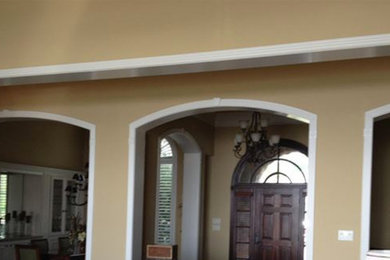 Example of an open concept living room design in Houston
