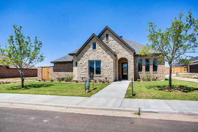 Mid-sized transitional beige one-story mixed siding house exterior photo with a shingle roof