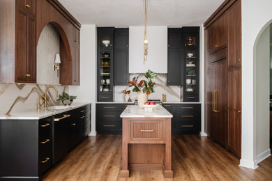 Kitchen - mid-sized transitional u-shaped kitchen idea in Jacksonville with a single-bowl sink and black appliances