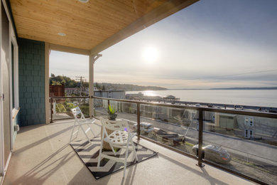 Inspiration for a mid-sized contemporary deck remodel in Seattle with a roof extension