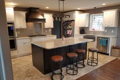 Example of a mid-sized transitional open concept kitchen design in Chicago with an island
