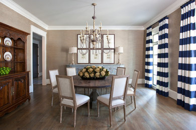 Design ideas for a traditional separate dining room in Atlanta with beige walls and medium hardwood floors.