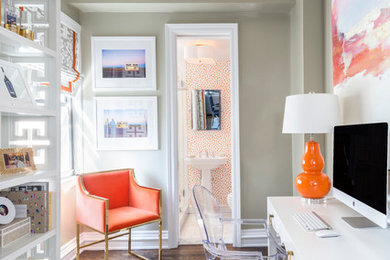 Example of a mid-sized transitional freestanding desk dark wood floor and brown floor study room design in New York with beige walls