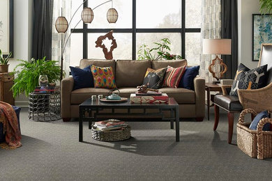 Example of a mid-sized classic formal and enclosed carpeted living room design in Other with beige walls, no fireplace and no tv
