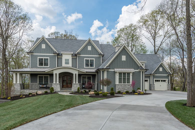 Large traditional blue three-story concrete fiberboard gable roof idea in Cincinnati