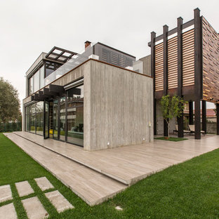 Idéer för ett stort industriellt grått hus, med två våningar, fiberplattor i betong och platt tak