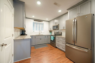 Inspiration for a kitchen remodel in Other with beaded inset cabinets and granite countertops