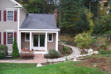 Photo of a large partial sun front yard landscaping in Boston.