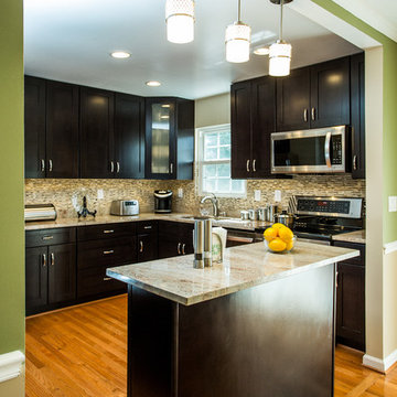Espresso Kitchen Remodel with Granite Island and Stainless Steel Appliances